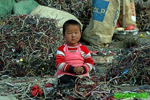 http://www.greenpeace.org/raw/image_full/international/photosvideos/photos/a-chinese-child-sits-amongst-a.jpg