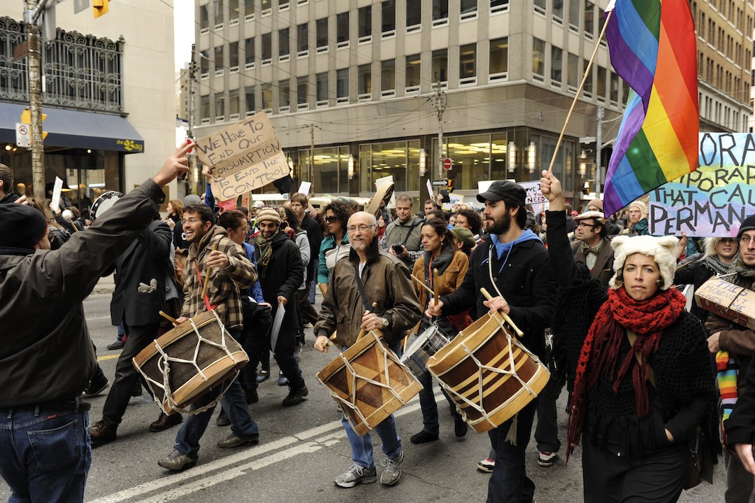 marchers and drummers walk on the street